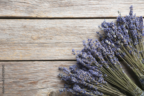 Fototapeta Naklejka Na Ścianę i Meble -  Bunch of lavender flowers on grey wooden background