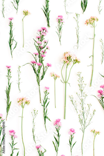 Floral pattern with pink and beige wildflowers, green leaves, branches on white background. Flat lay, top view. Valentine's background © Floral Deco