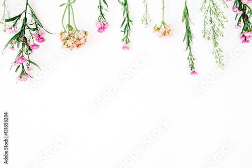 Colorful wildflowers on white background. Flat lay, top view. Valentine's background