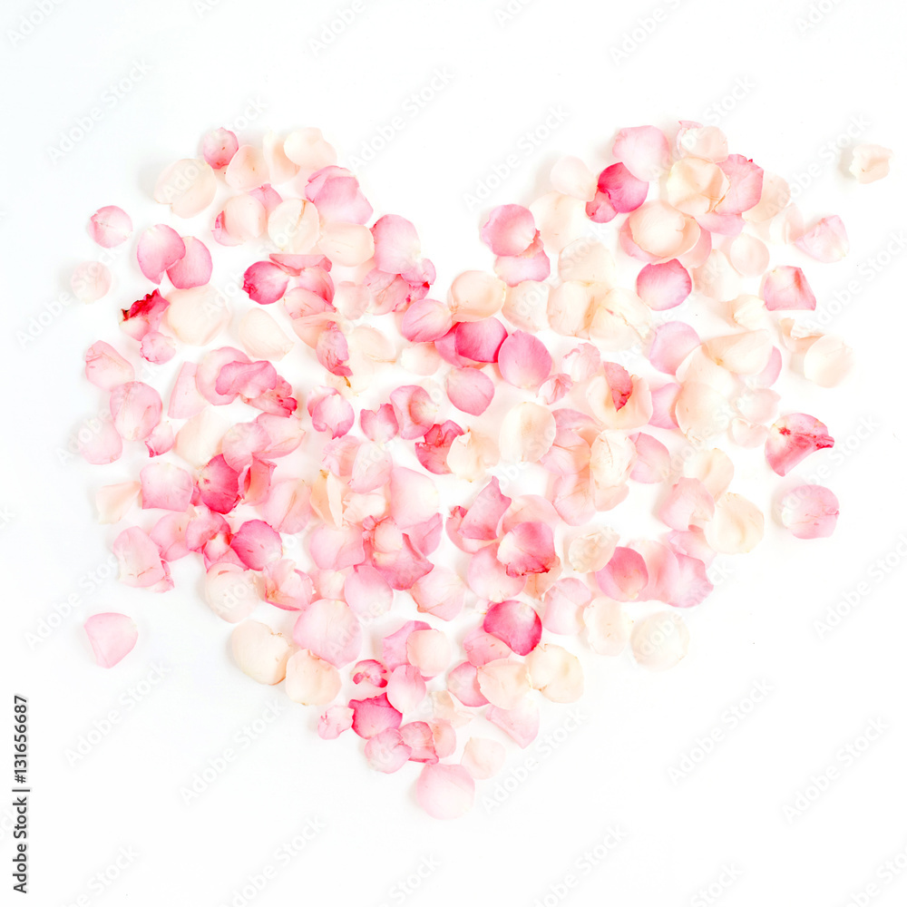 Heart symbol made of pink rose petals. Valentine's day background. Flat lay, top view