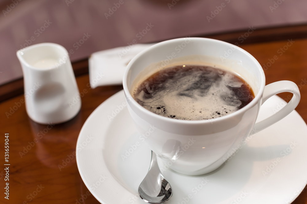 A cup of coffee on the table A cup of coffee on the table