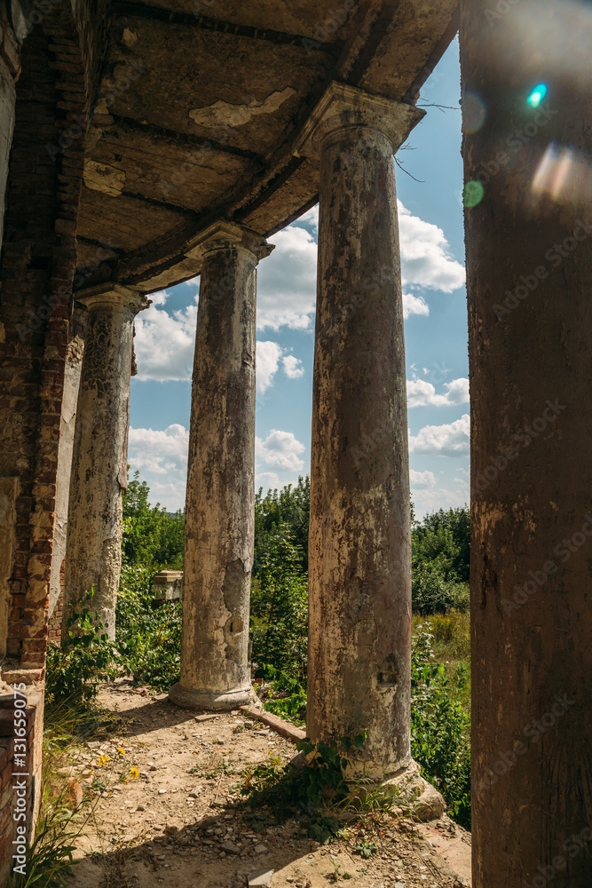 Old rounded balcony with columns, an abandoned manor of Earl Voeikov