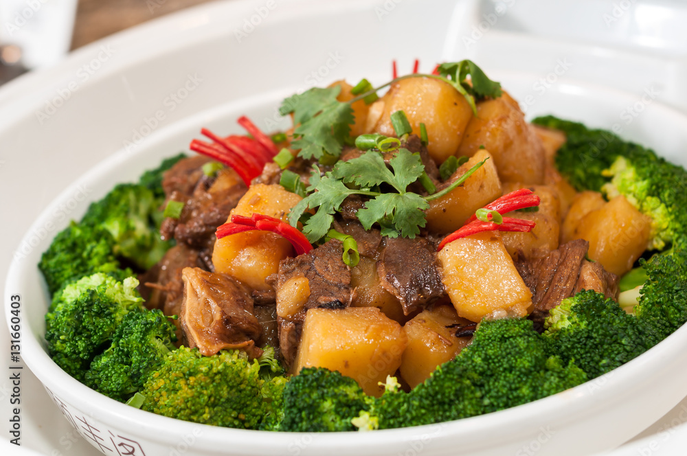 Roast mutton with potatoes and broccoli Roast mutton with potatoes and broccoli