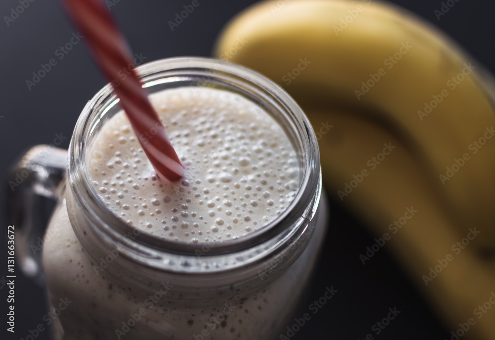 Healthy smoothie on gray background. Banana,oats,chia seeds and honey mix. Healthy smoothie on gray background. Banana,oats,chia seeds and honey mix.