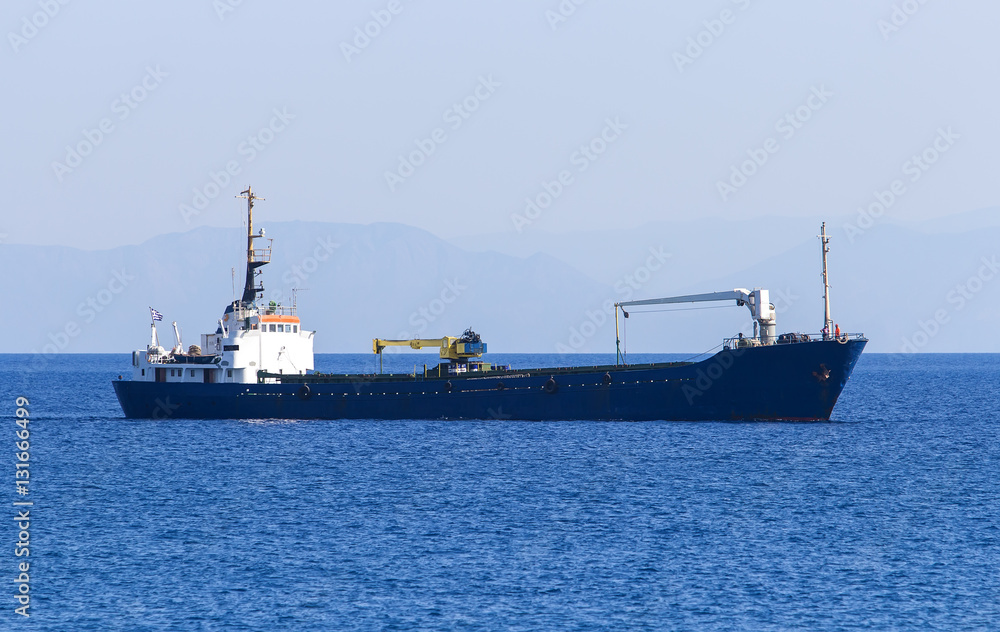 empty cargo ship sailing on the sea.Greece, Rhodes empty cargo ship sailing on the sea.Greece, Rhodes