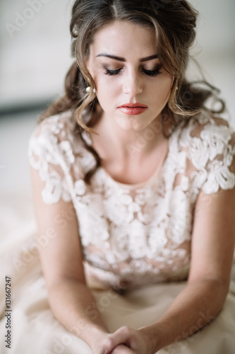 portrait of the bride crying, sadness, streaks of ink. Natural light