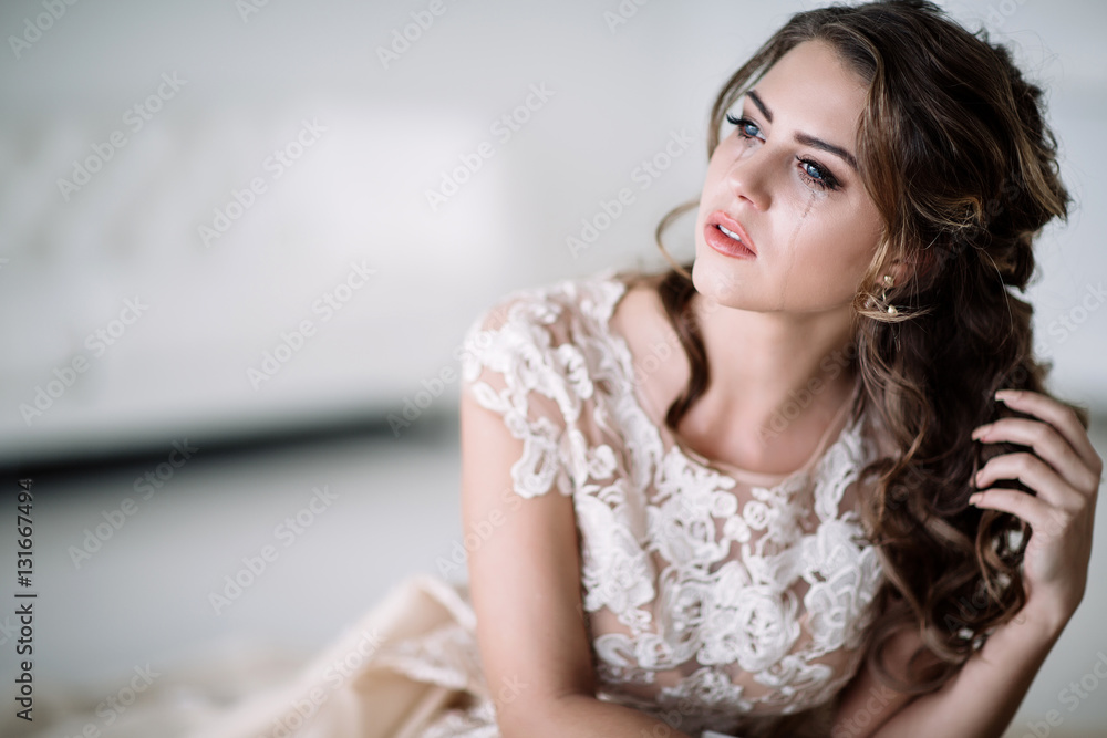 portrait of the bride crying, sadness, streaks of ink. Natural light portrait of the bride crying, sadness, streaks of ink. Natural light