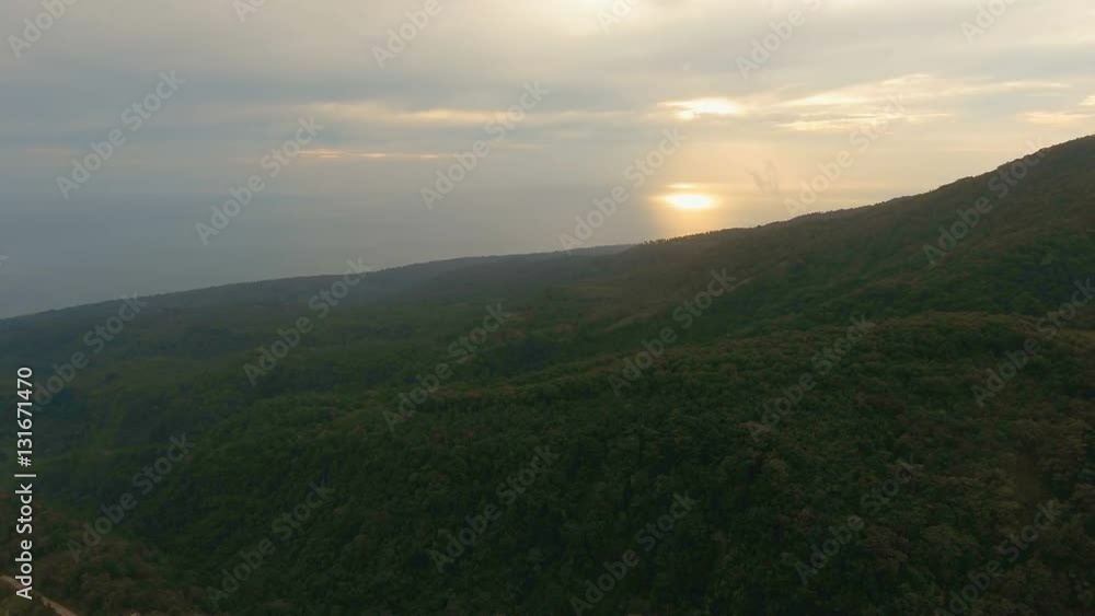 Sunset on tropical island, ocean, mountains. Aerial view coastline on tropical island with sea, trees and palms. Aerial footage.Aerial video from flying drone of amazingly beautiful landscape of Sunset on tropical island, ocean, mountains. Aerial view coastline on tropical island with sea, trees and palms. Aerial footage.Aerial video from flying drone of amazingly beautiful landscape of