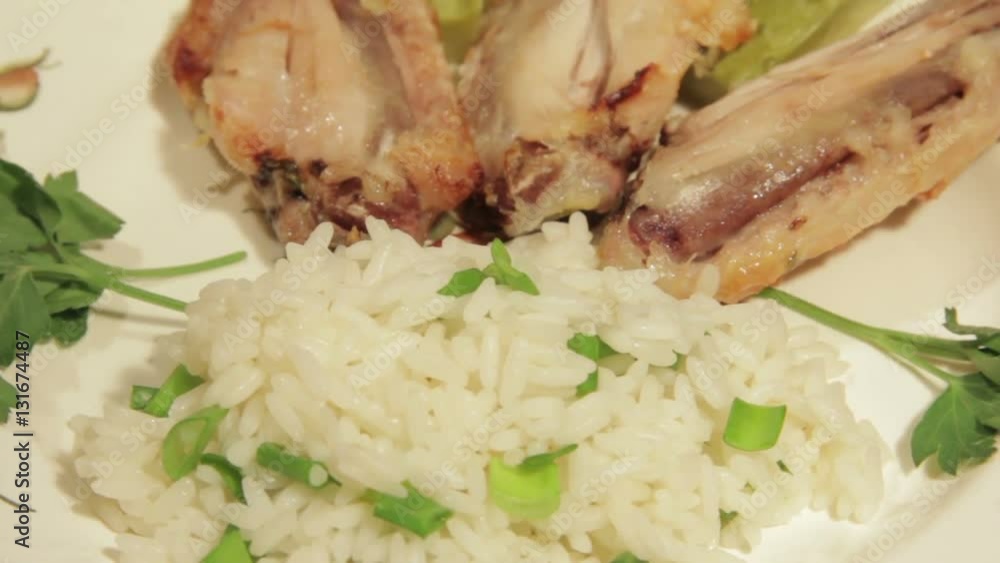 Dishes portion from chicken wings with rice. Dishes portion from chicken wings with rice.