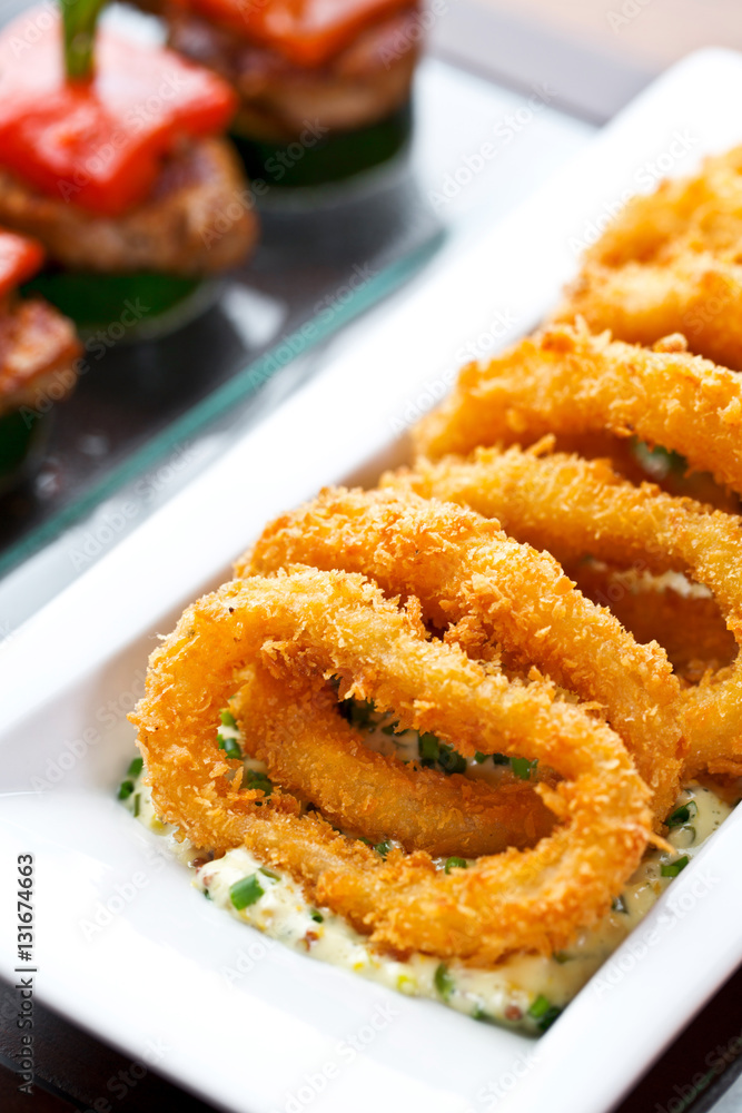 set of finger food - breaded squid rings with tartar sauce set of finger food - breaded squid rings with tartar sauce