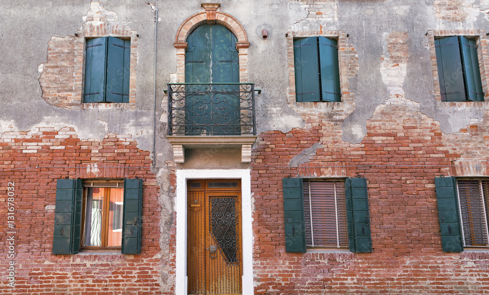 Vintage building facade on Burano island, Italy.