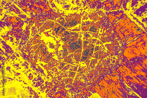 Colorful, abstract pattern of mineral in a polarizing micrograph