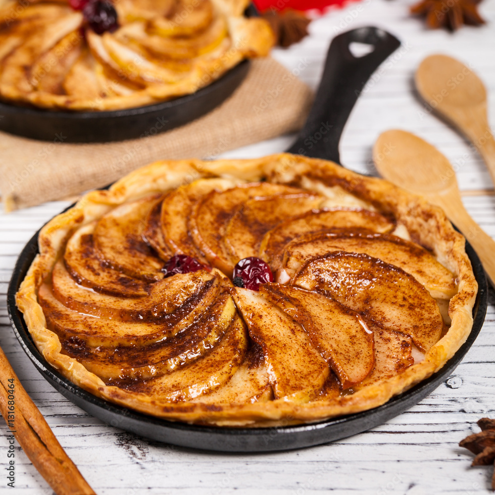 Cast Iron Skillet Apple Cake. Selective focus. Photos Adobe Stock