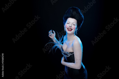 Obraz na plátně actress brunette woman with high hair in corset decorated with feathers in antiq