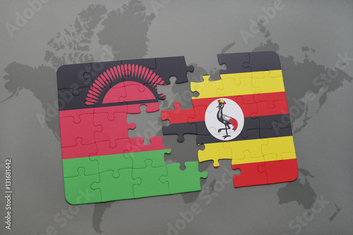 puzzle with the national flag of malawi and uganda on a world map