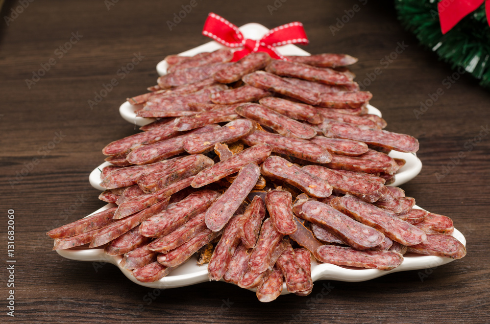 flat sausage in a white plate flat sausage in a white plate