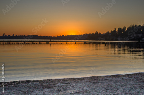 A view of a lake and pier in a winter sunset at Juanita Bay Park, Kirkland, Washington © Mauro