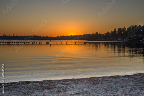 A view of a lake and pier in a winter sunset at Juanita Bay Park, Kirkland, Washington photo