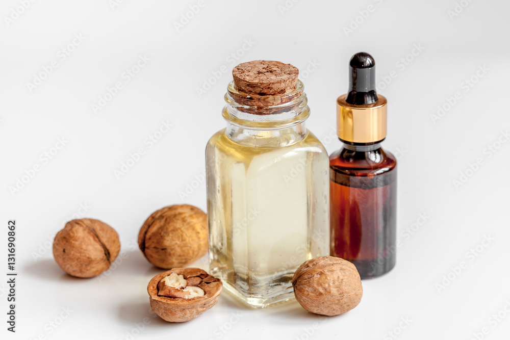 cosmetic and therapeutic walnut oil on white background cosmetic and therapeutic walnut oil on white background