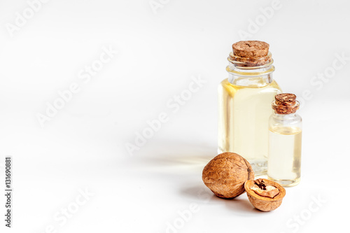 cosmetic and therapeutic walnut oil on white background