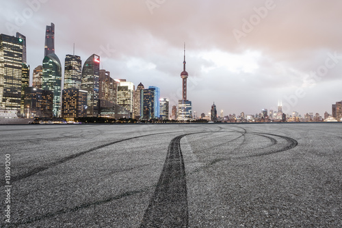 Asphalt road and modern cityscape at night in Shanghai © ABCDstock