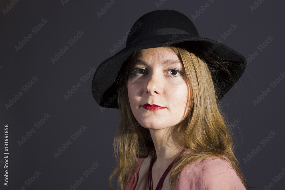 Portrait of a young woman in a hat Portrait of a young woman in a hat
