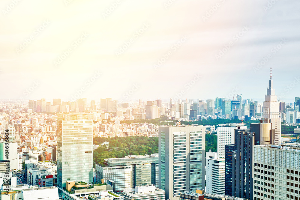 Fototapeta premium Asia Business concept for real estate and corporate construction - panoramic modern cityscape building bird eye aerial view under sunrise and morning blue bright sky in Tokyo, Japan