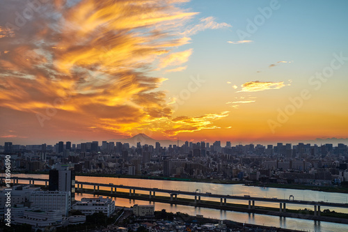 Asia Business concept for real estate and corporate construction - panoramic modern cityscape building bird eye aerial view with Mount Fuji under sunrise and morning blue bright sky in Tokyo,Japan © voyata