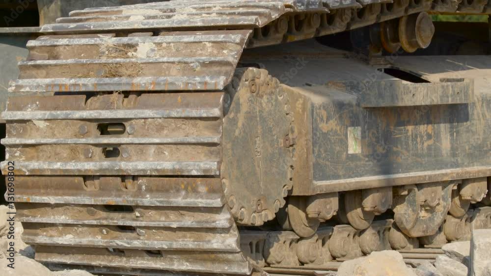 The old flat tire of the big heavy equipment in the construction site one of the big machinery used in big industries The old flat tire of the big heavy equipment in the construction site one of the big machinery used in big industries