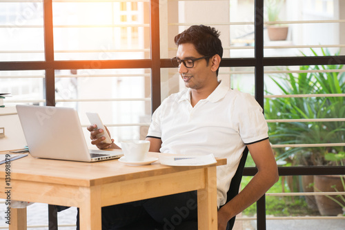 casual indian male working at office