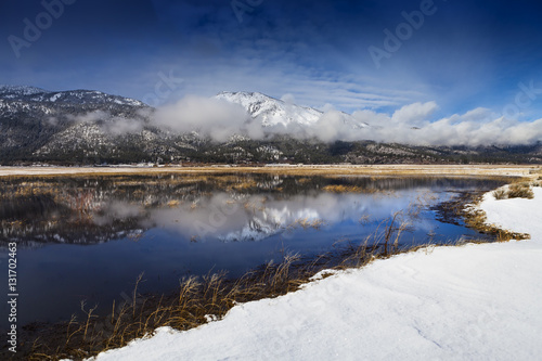 Washoe Valley, Nevada. Pond reflection and slide mountain in winter with snow.