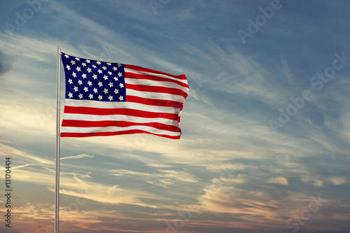 Flag of United States of America on sunset
