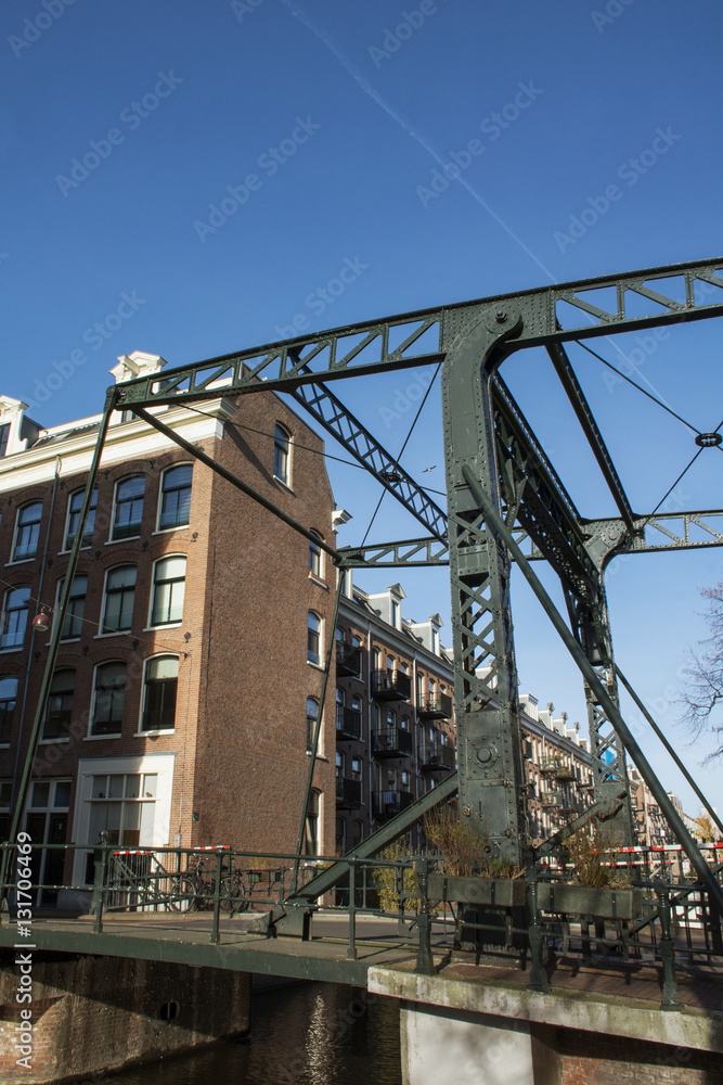 Modern green bridge in Amsterdam in the day