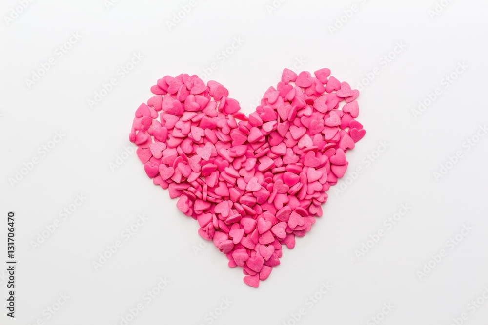 pink heart made of small hearts on a white background. festive background for birthday, Valentine's day, wedding, celebration. pink heart made of small hearts on a white background. festive background for birthday, Valentine's day, wedding, celebration.
