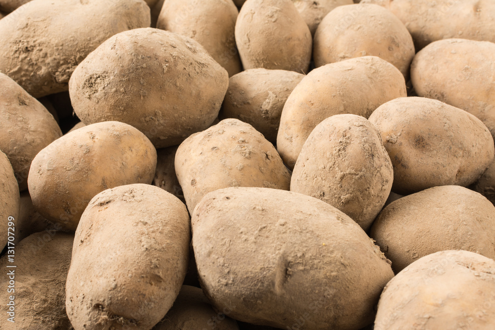Stack of fresh potatoes straight from the ground Stack of fresh potatoes straight from the ground