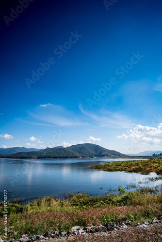 Lake with mountain and blue sky background © cjansuebsri