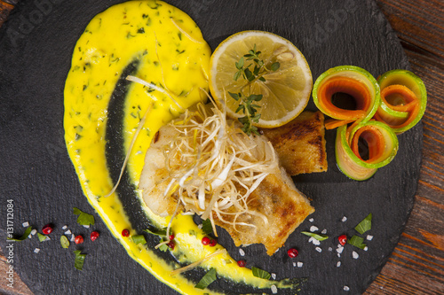 Pike perch with sauce and lemon
