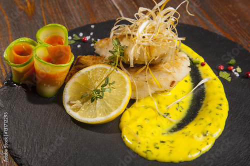 Pike perch with sauce and lemon