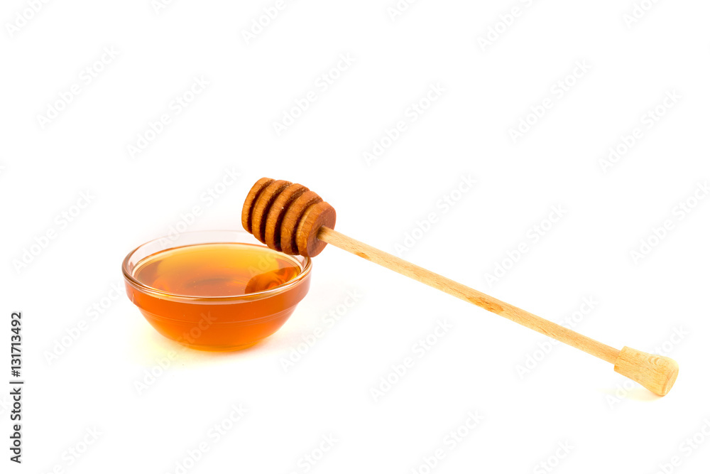 Honey in jar or bowl with wooden stick isolated on white background Honey in jar or bowl with wooden stick isolated on white background