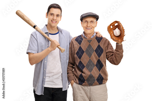 Young man with a baseball bat and a senior with a glove