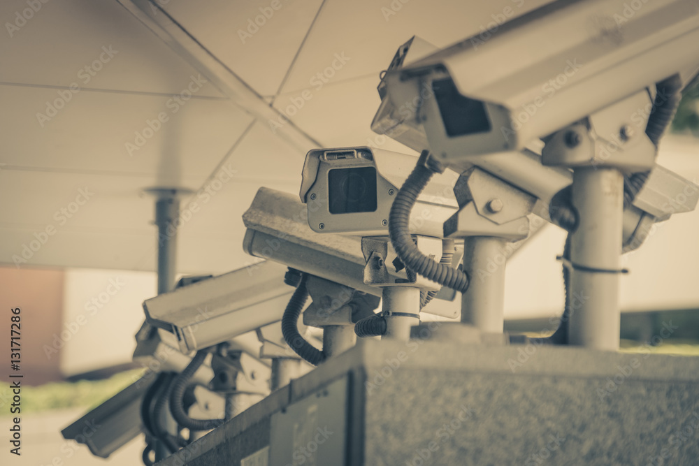 Surveillance cameras in a Singapore street Surveillance cameras in a Singapore street