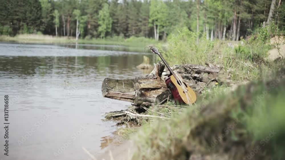 Nature. The forgotten guitar on the bank of the lake. Nature. The forgotten guitar on the bank of the lake.