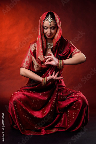 Portrait of beautiful indian girl . Young hindu woman model kundan jewelry . Traditional costume