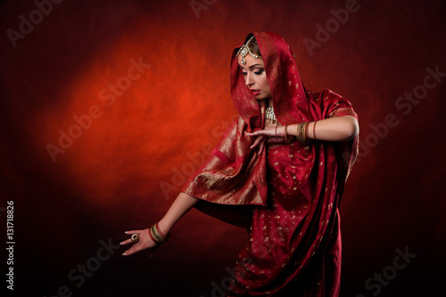 Portrait of beautiful indian girl . Young hindu woman model kundan jewelry . Traditional costume
