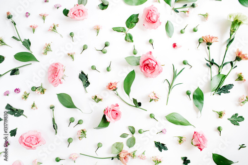 Fotografie, Obraz Floral pattern made of pink and beige roses, green leaves, branches on white background