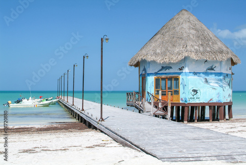 The coast with wooden pier of Holbox Island photo