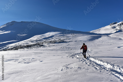 Hiker walking on mountain top Kasprowy Wierch. Tatra mountain