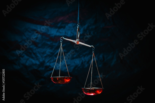 Golden scale of justice in blue tone