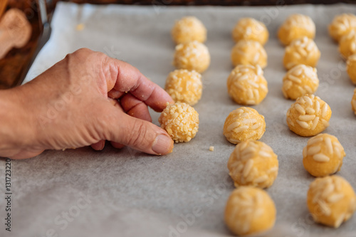 Man kneading marzipan for make panellets. photo