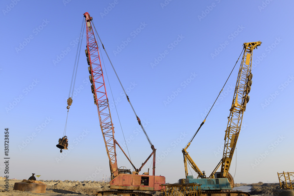 Crawler crane in the construction site Crawler crane in the construction site